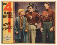 3m494 HORSE FEATHERS LC '32 Harpo Marx makes his meanest face at two huge football players!